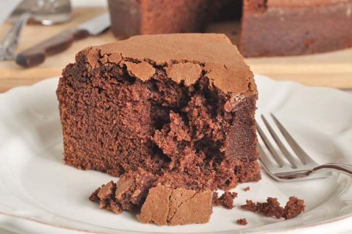 Enjoying a Slice of  Eggless Chocolate Brownie Cake